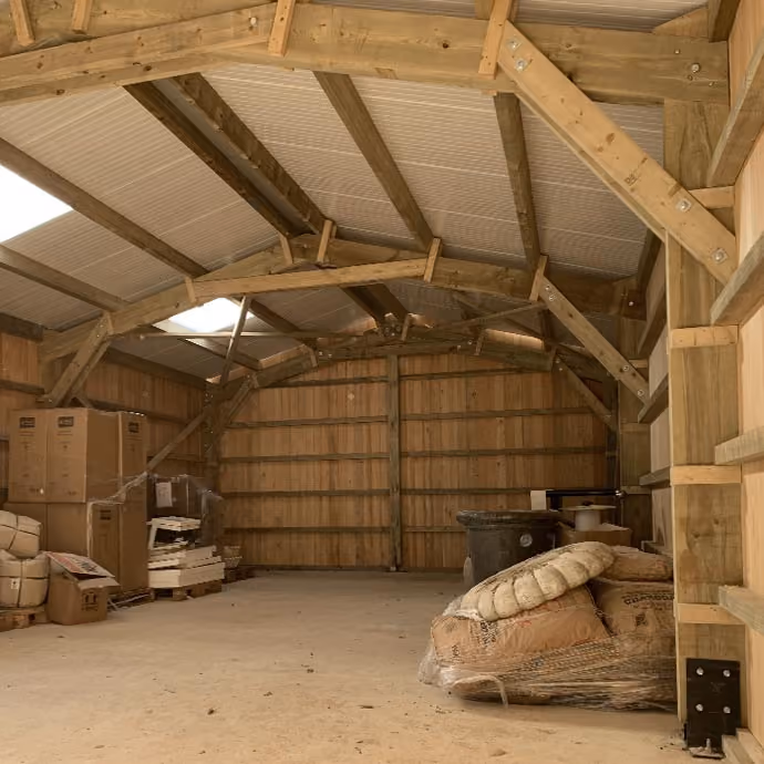 Interior of a timber-framed farm storage shed